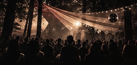An intimate forest gathering under warm lights